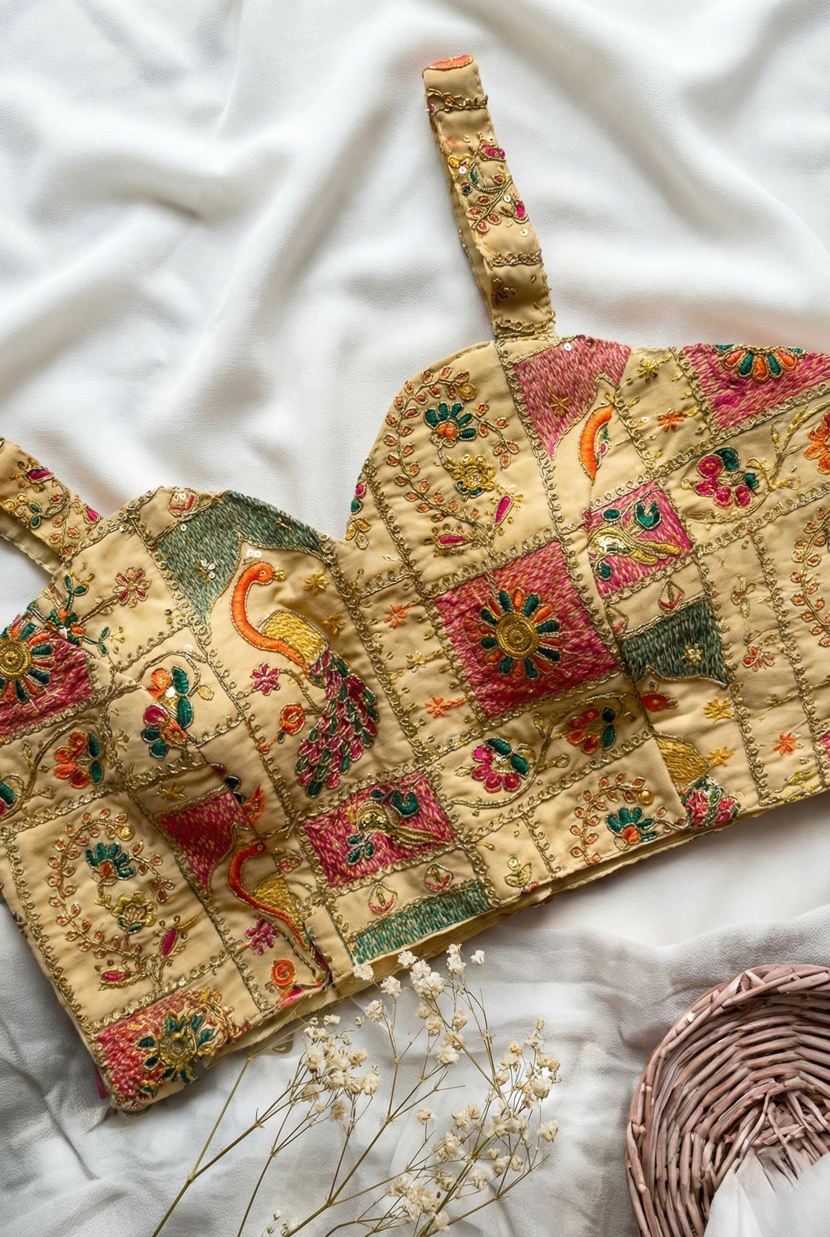 Heavy embroidered sleeveless padded blouse