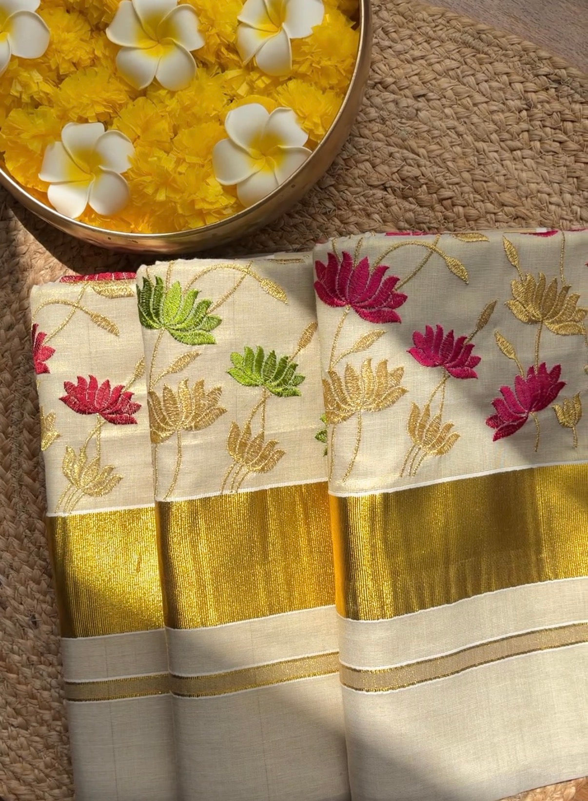 Kerala kasavu saree in lotus embroidery