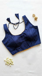 Silk blouse with gold lace detailing and zari bhutta