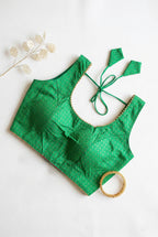 Silk blouse with gold lace detailing and zari bhutta