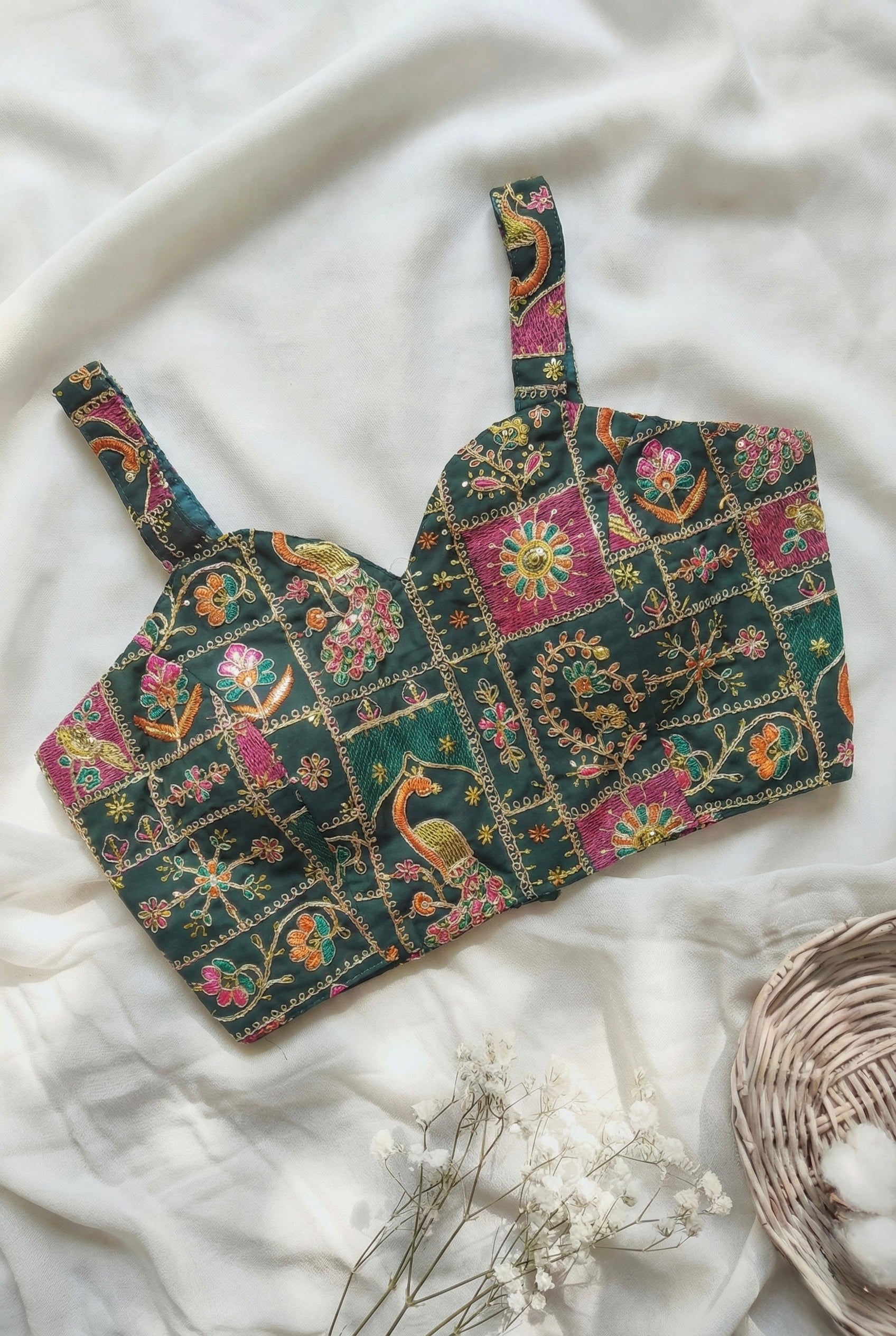 Heavy embroidered sleeveless padded blouse