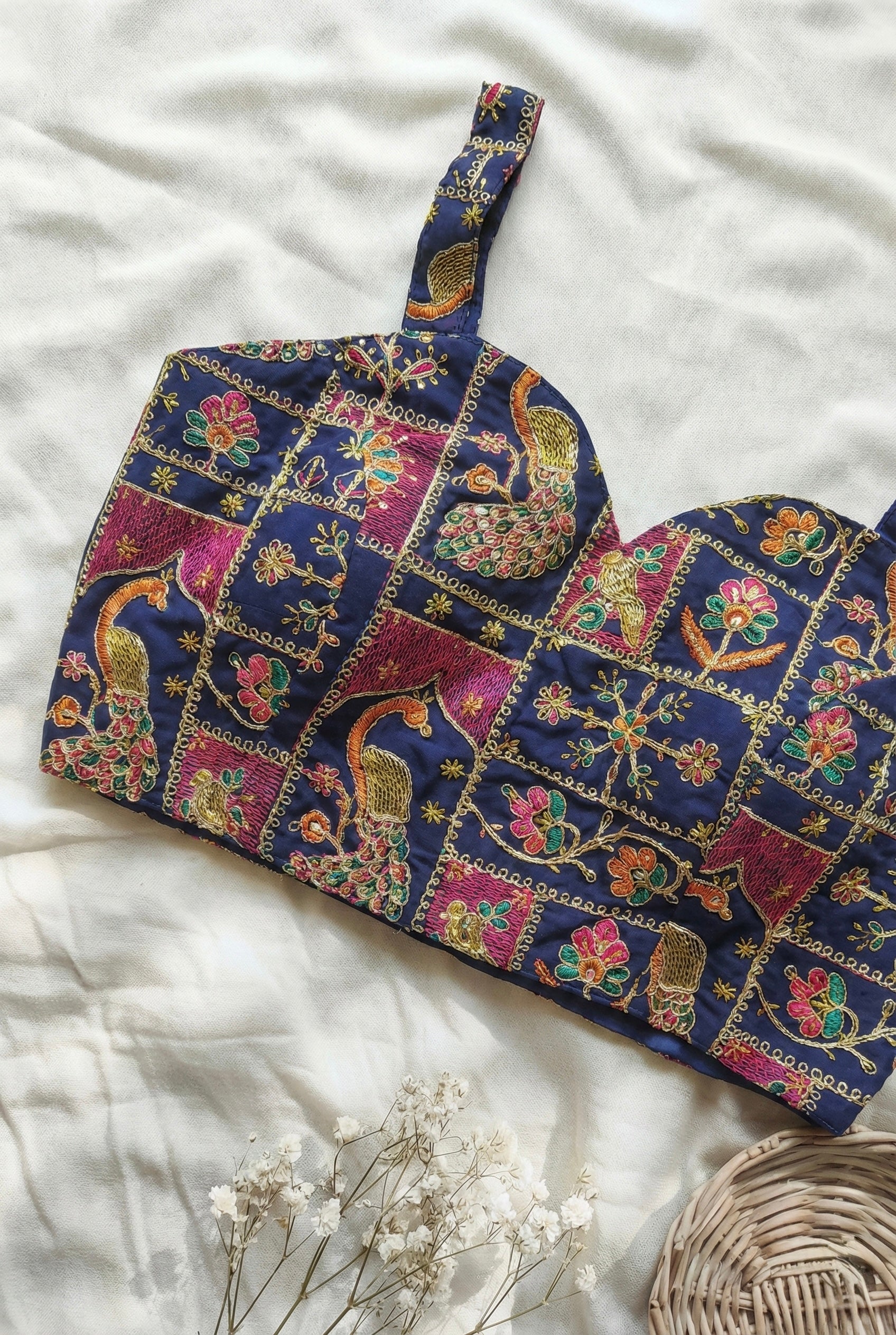 Heavy embroidered sleeveless padded blouse