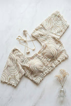 Khadi half sleeve padded blouse in swirl embroidery pattern