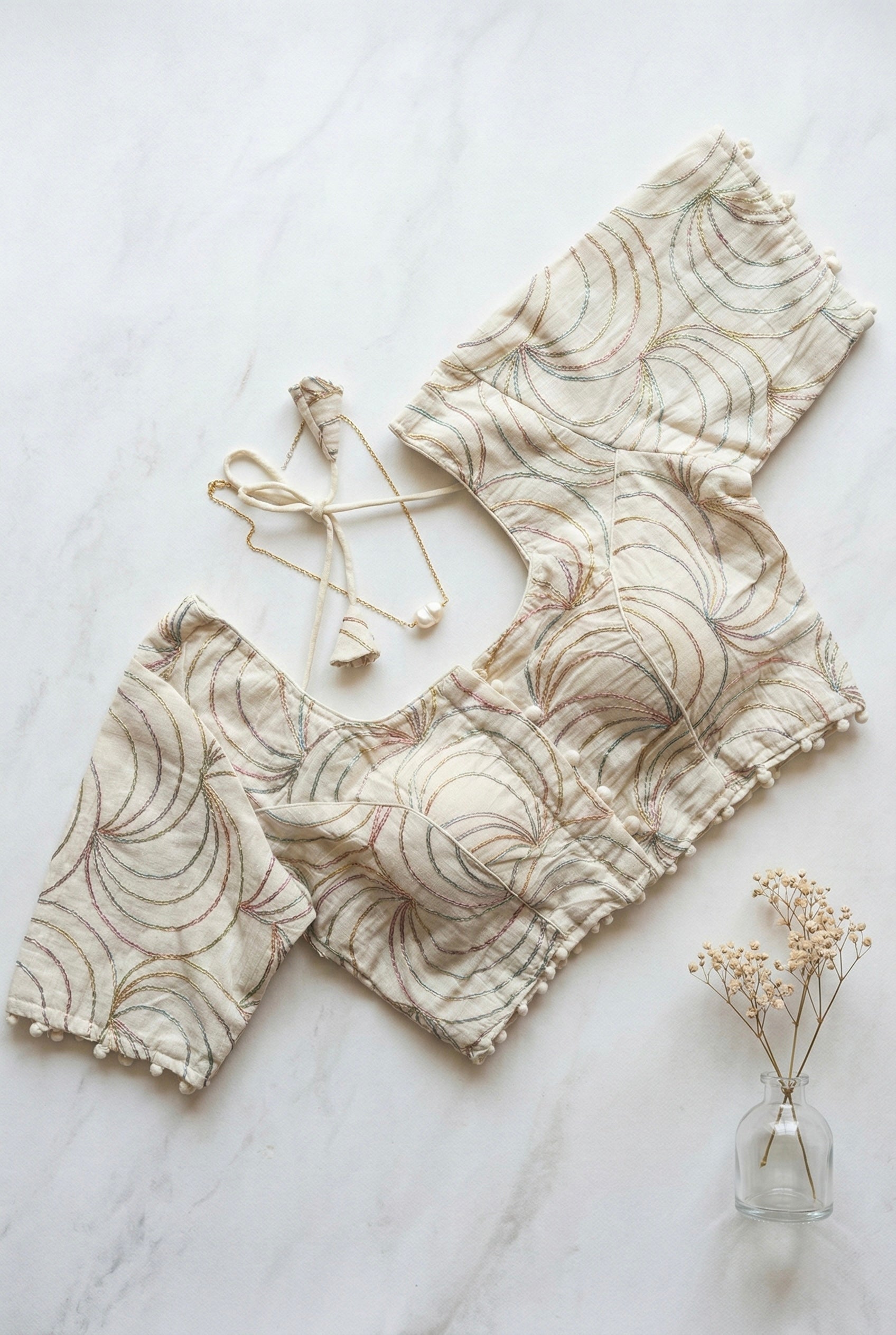 Khadi half sleeve padded blouse in swirl embroidery pattern