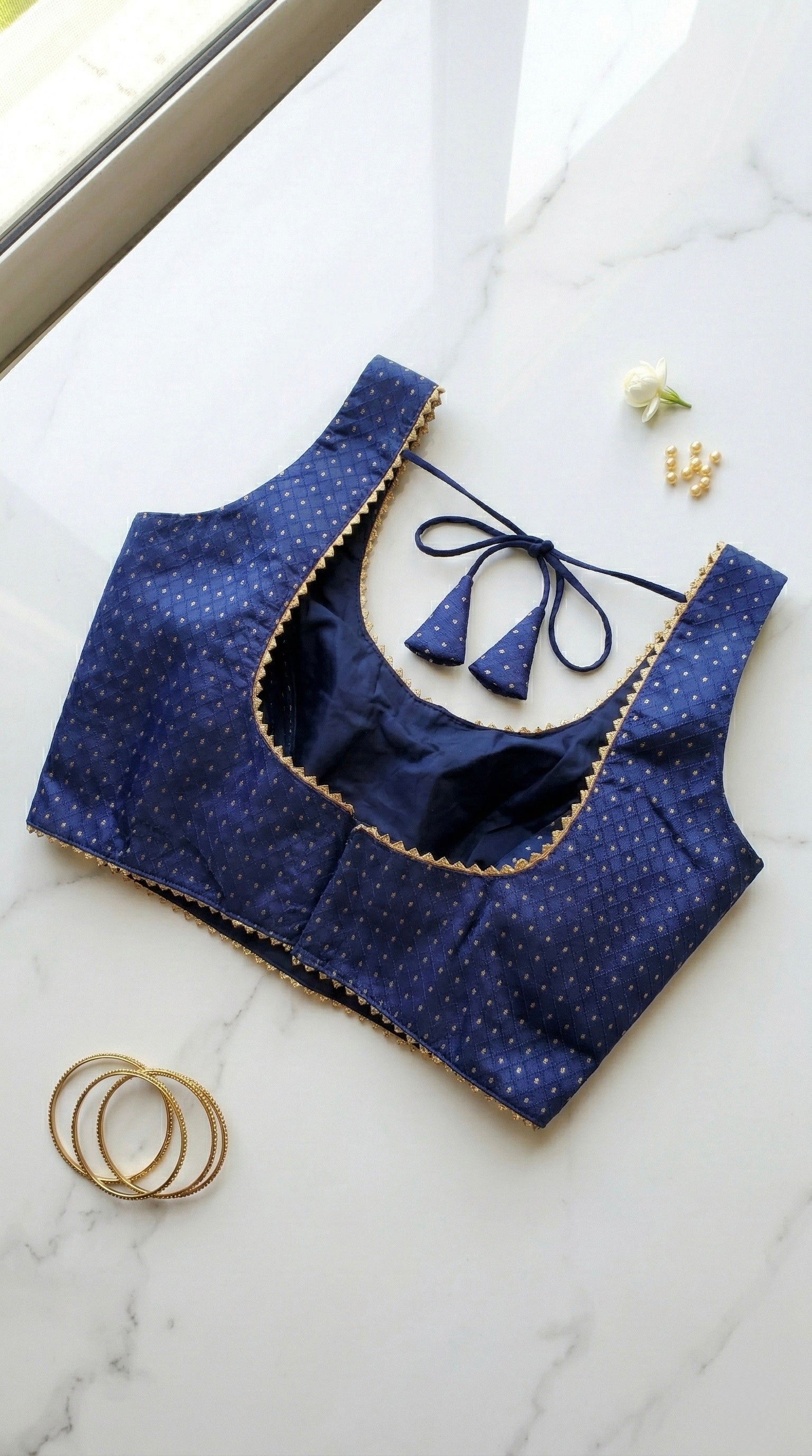 Silk blouse with gold lace detailing and zari bhutta