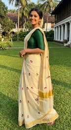 Kerala kasavu saree with tulip flower thread motifs