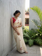 Kerala saree in gold stripes and thread floral embroidery.
