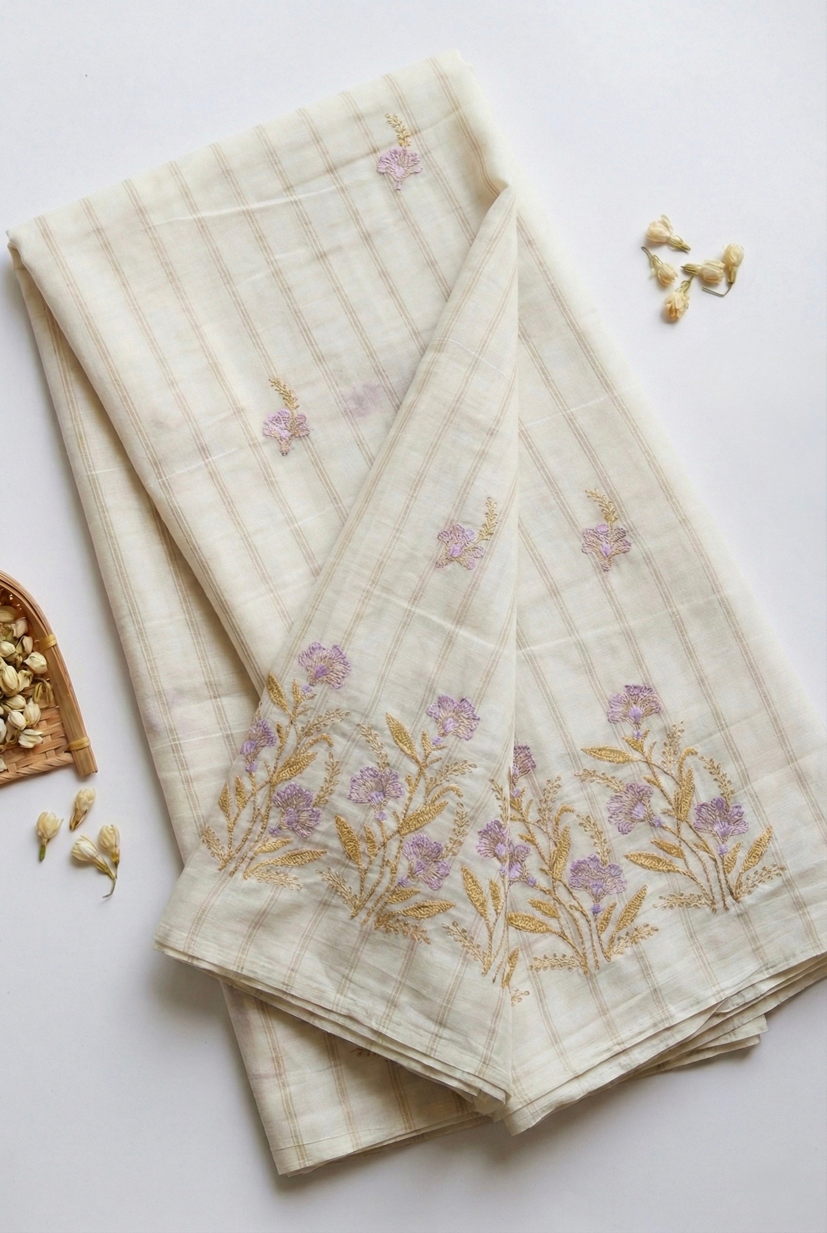 Kerala saree in gold stripes and thread floral embroidery.