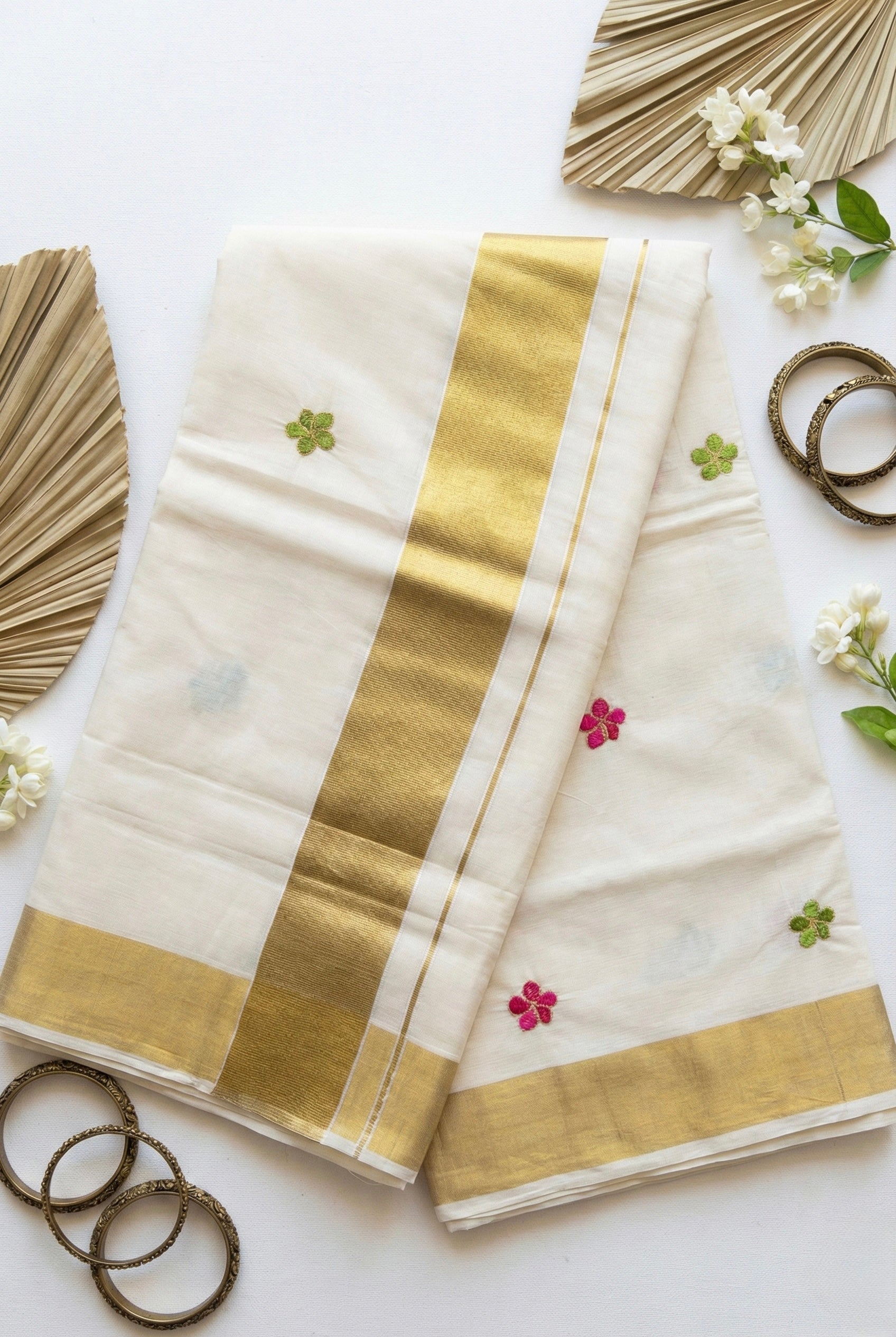 Kerala kasavu saree with small flower embroidered motifs