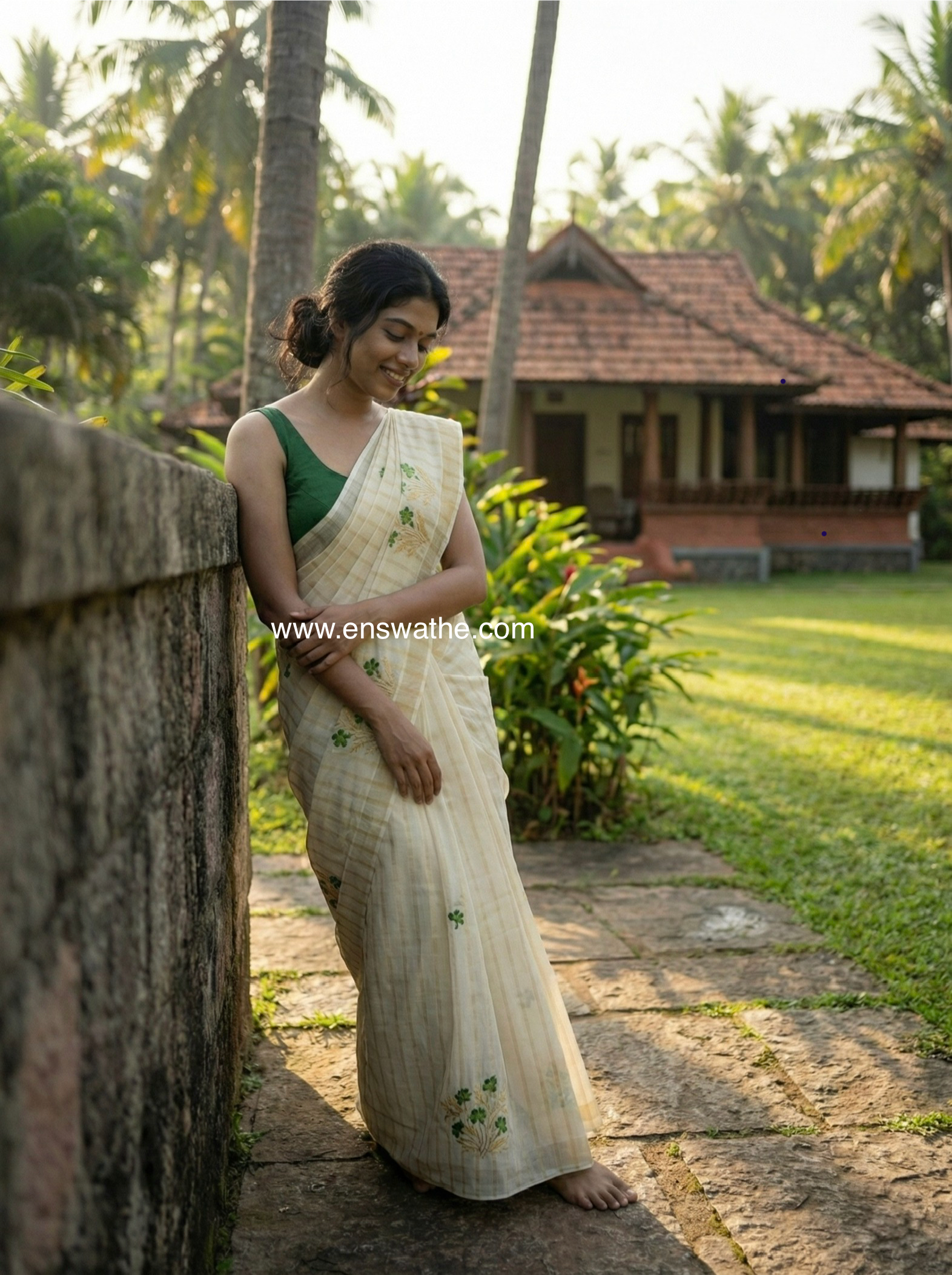 Kerala saree in gold stripes and thread floral embroidery.