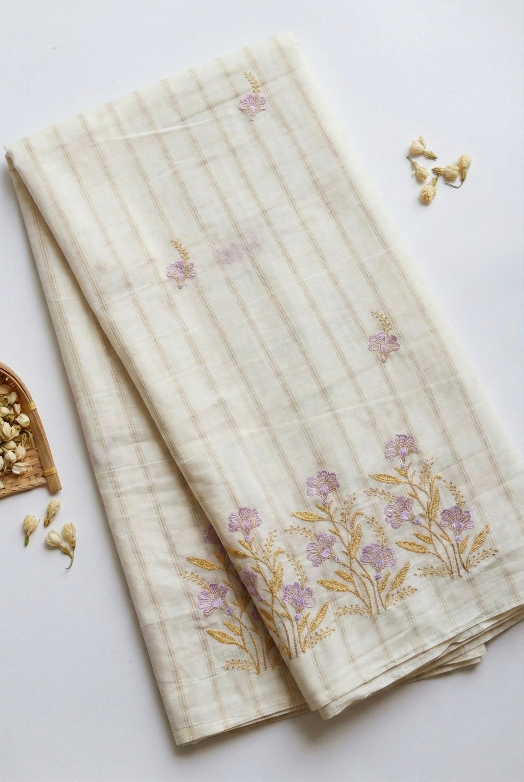 Kerala saree in gold stripes and thread floral embroidery.