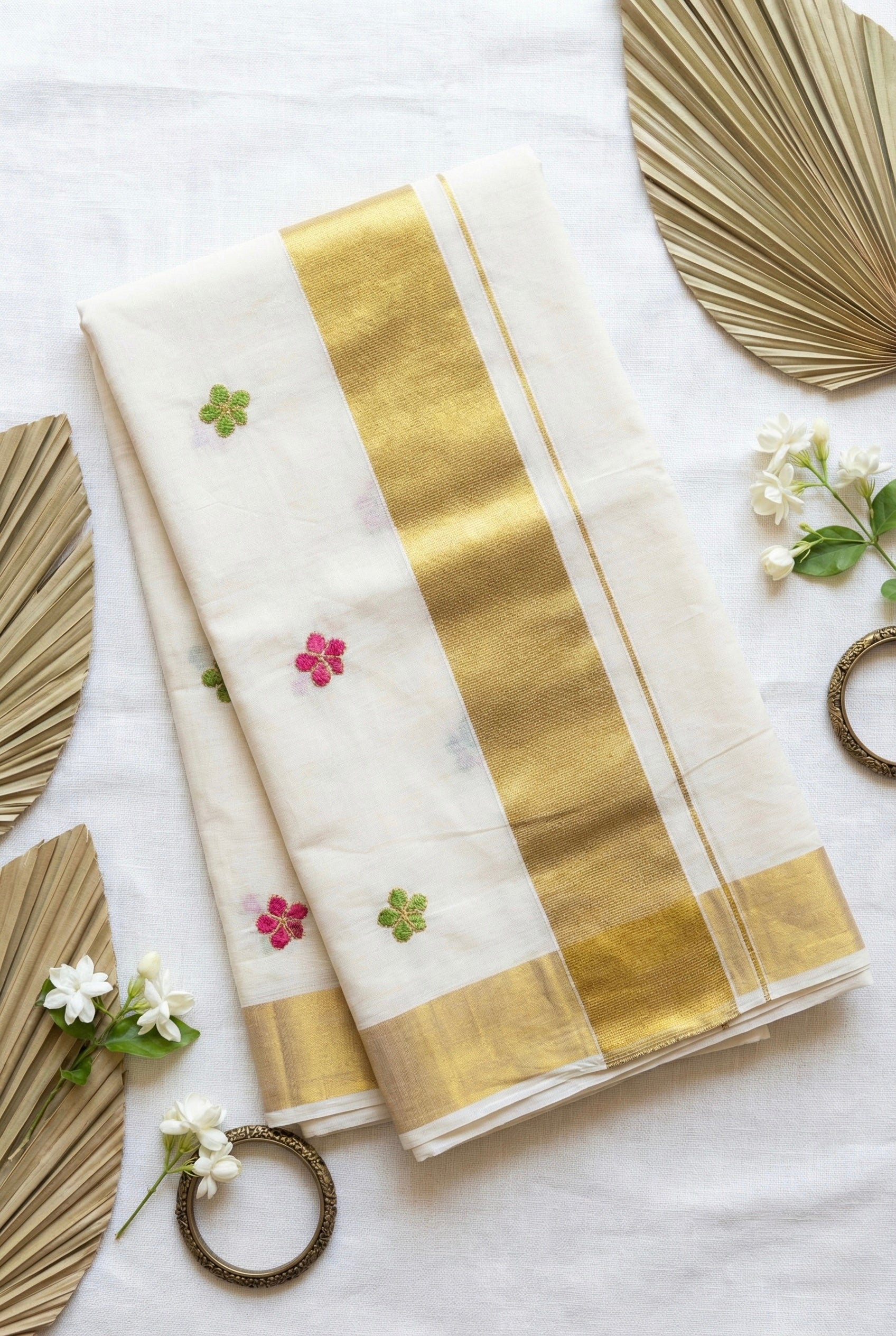 Kerala kasavu saree with small flower embroidered motifs