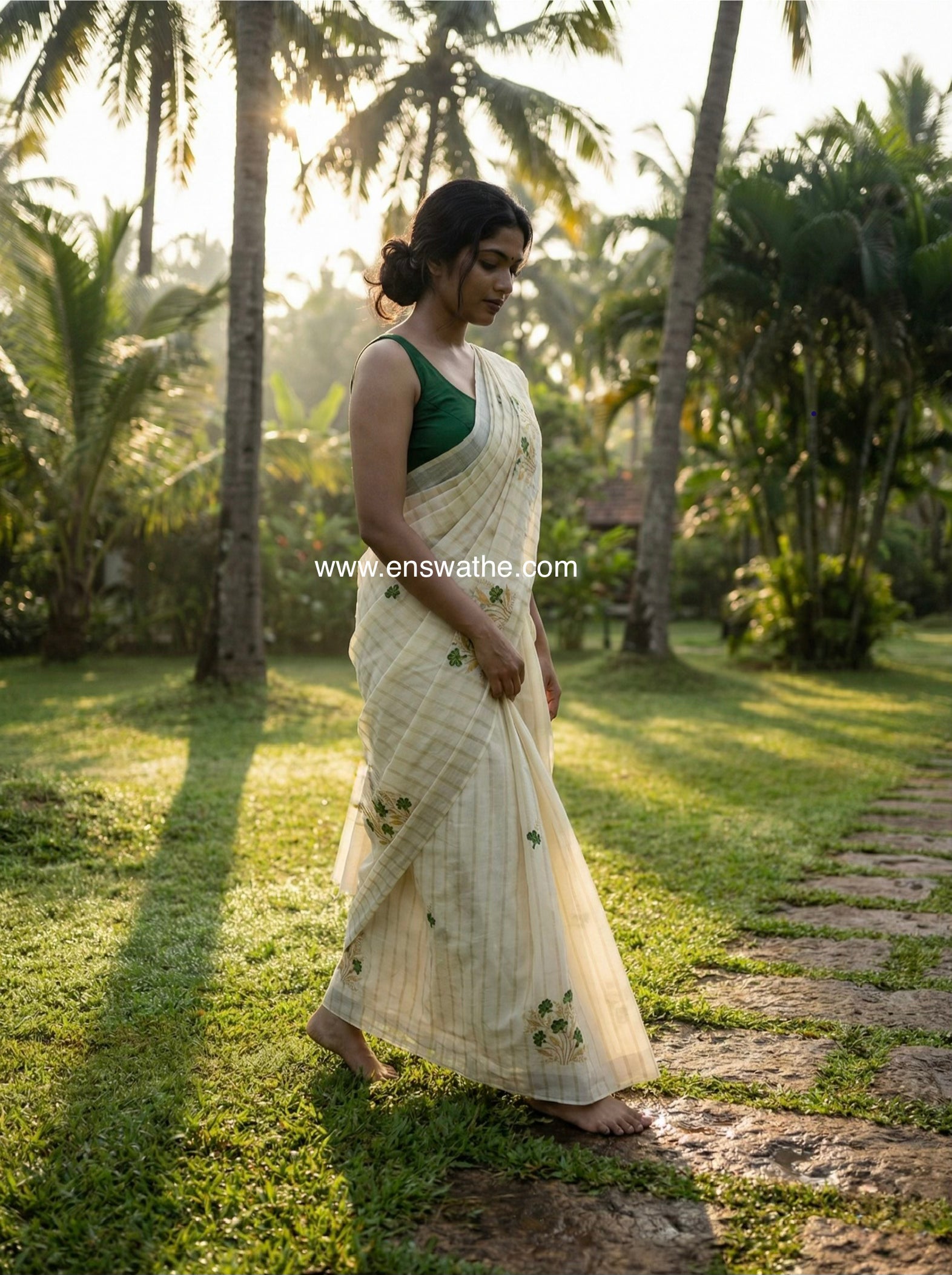 Kerala saree in gold stripes and thread floral embroidery.