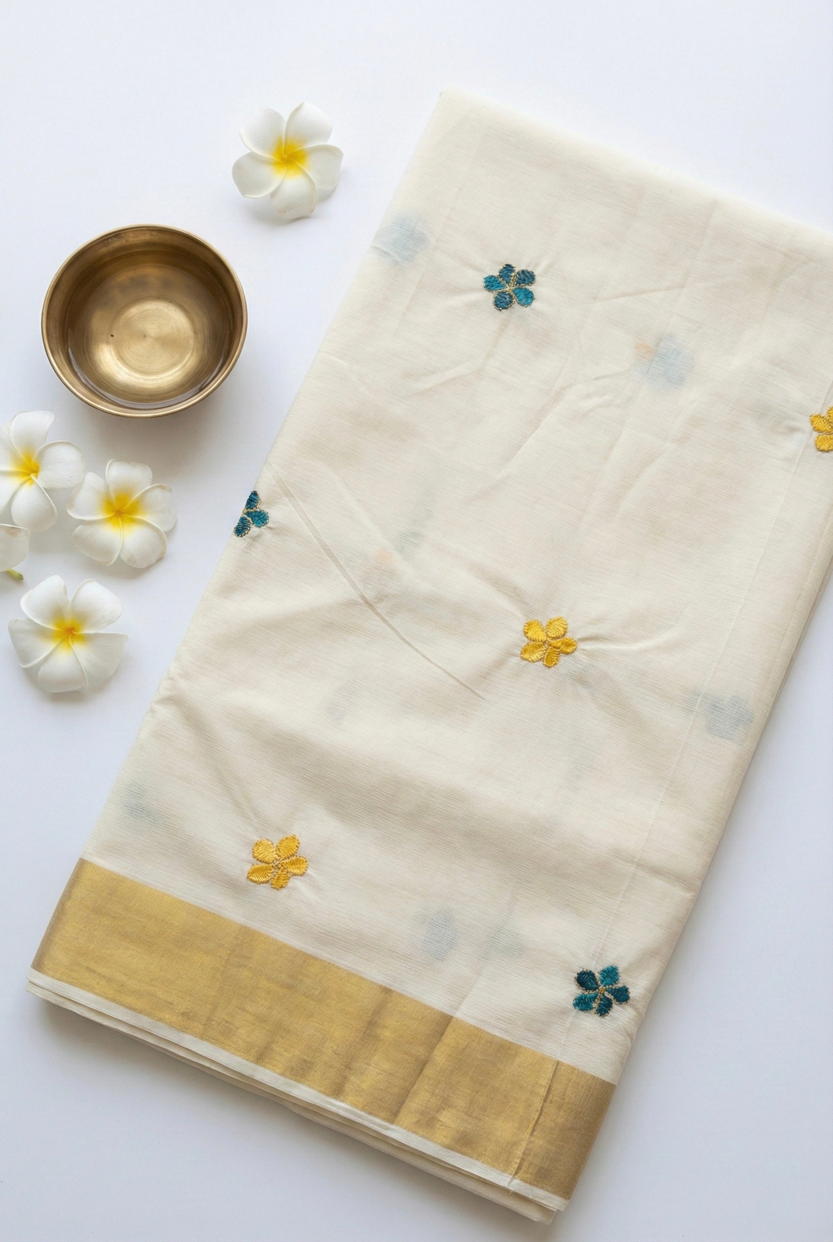 Kerala kasavu saree with small flower embroidered motifs