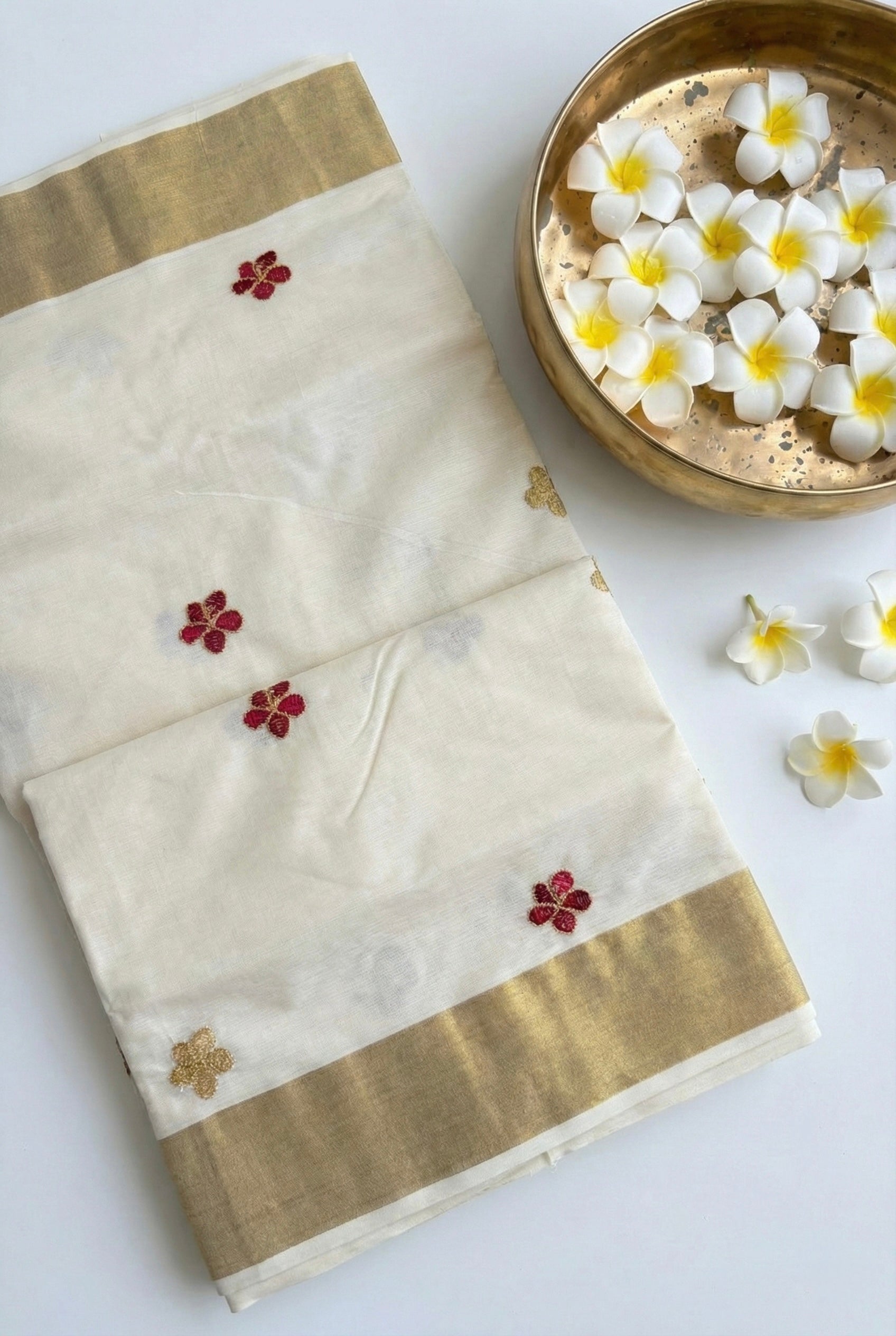 Kerala kasavu saree with small flower embroidered motifs