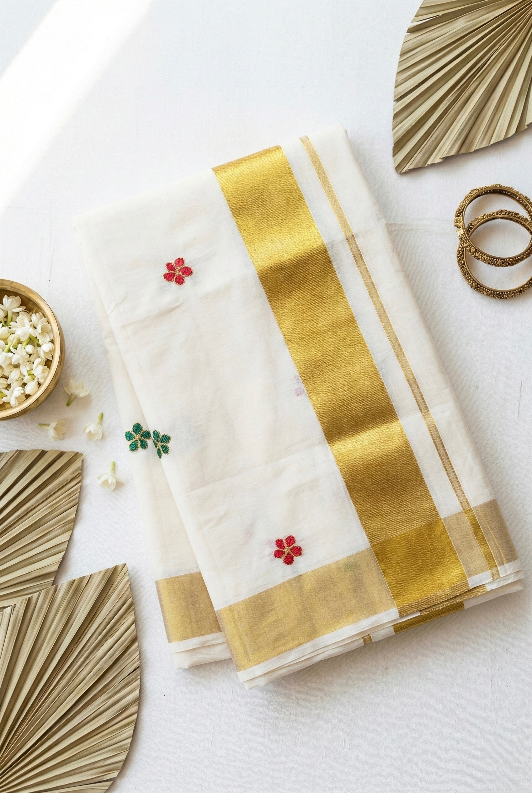 Kerala kasavu saree with small flower embroidered motifs