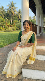 Kerala kasavu saree with tulip flower thread motifs