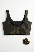 Noir Glow - Sleeveless padded shimmer blouse