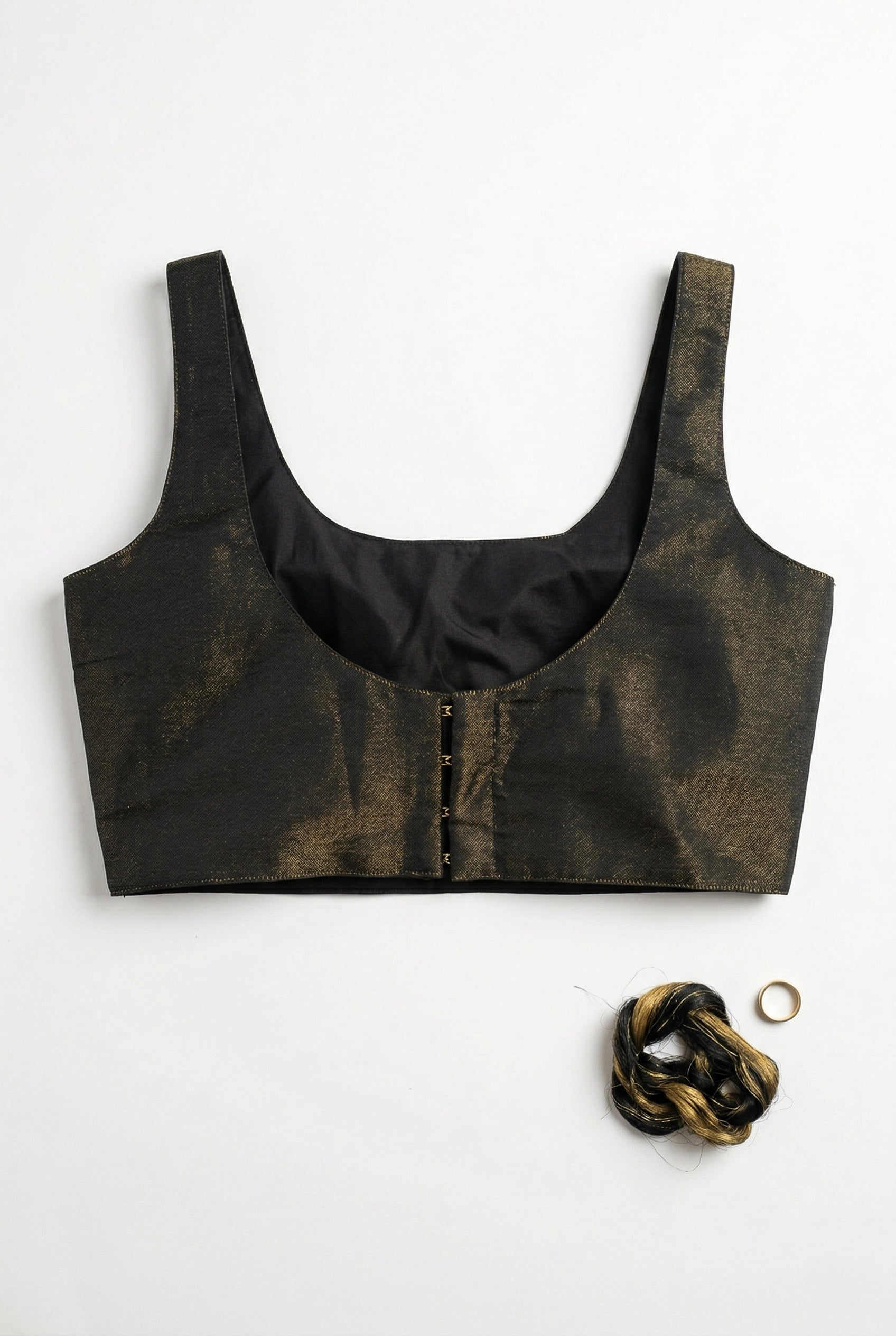 Noir Glow - Sleeveless padded shimmer blouse