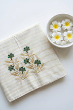 Kerala saree in gold stripes and thread floral embroidery.