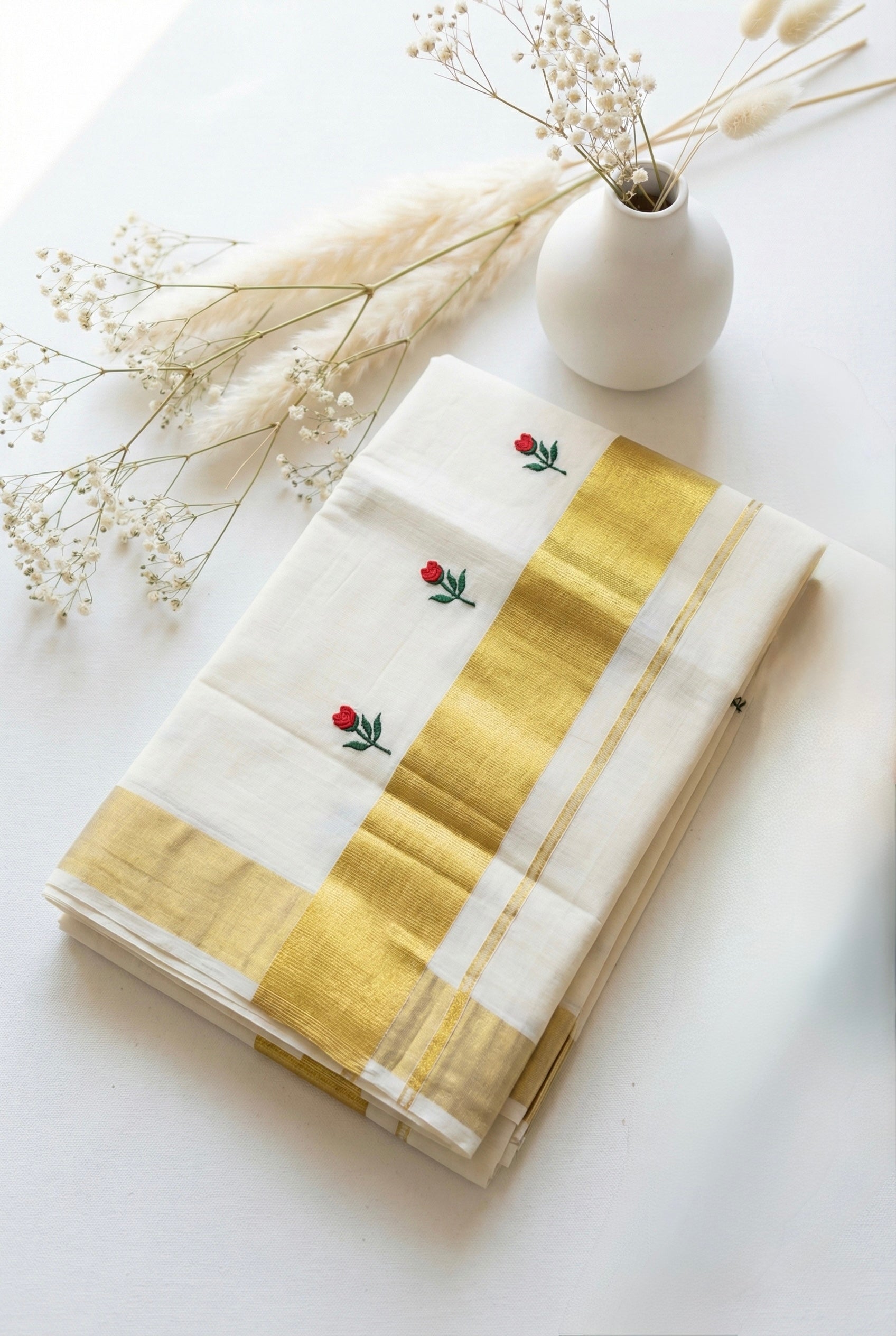 Kerala kasavu saree with tulip flower thread motifs