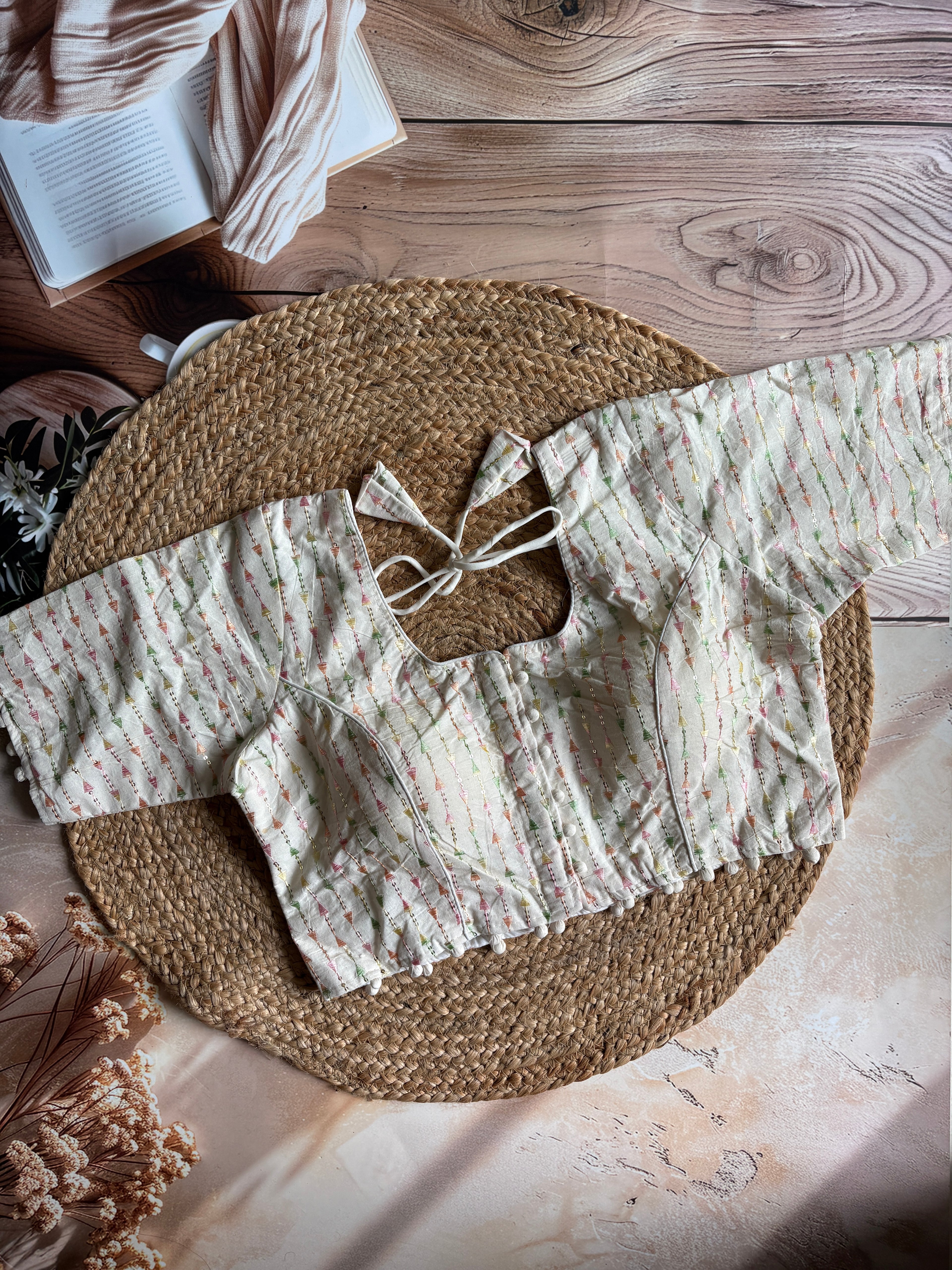 Khadi half sleeve padded blouse in linear pattern pastel embroidery