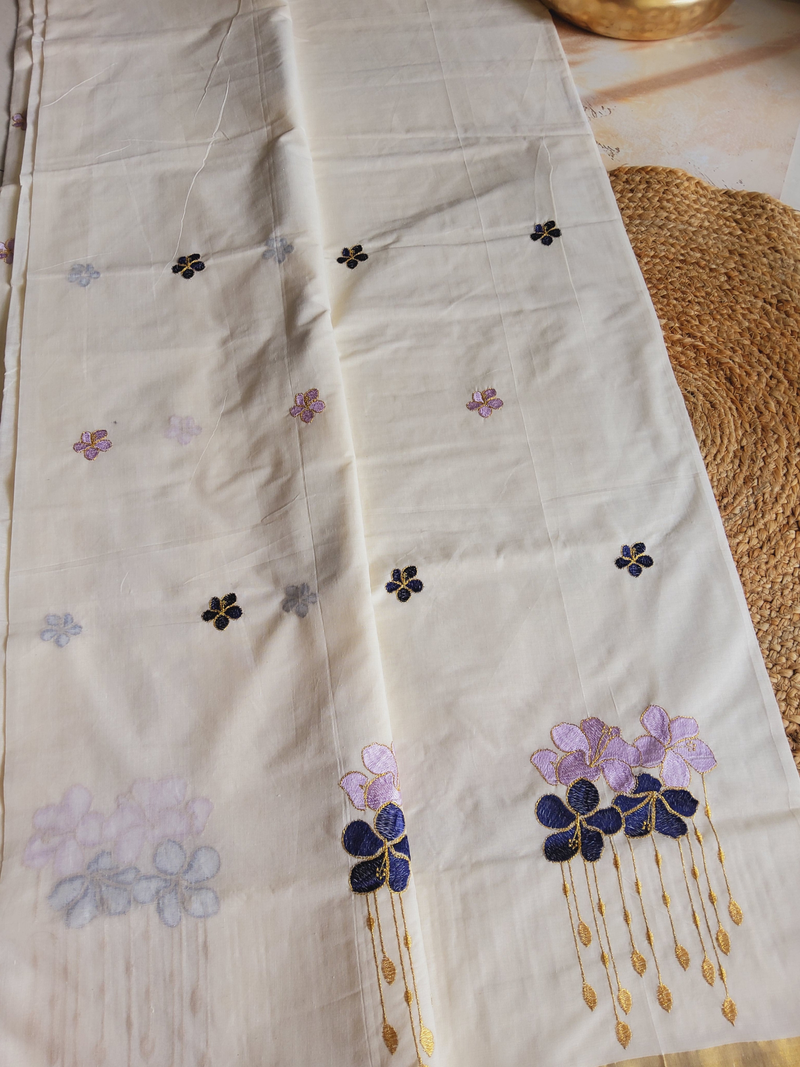 Kerala kasavu saree with floral embroidery