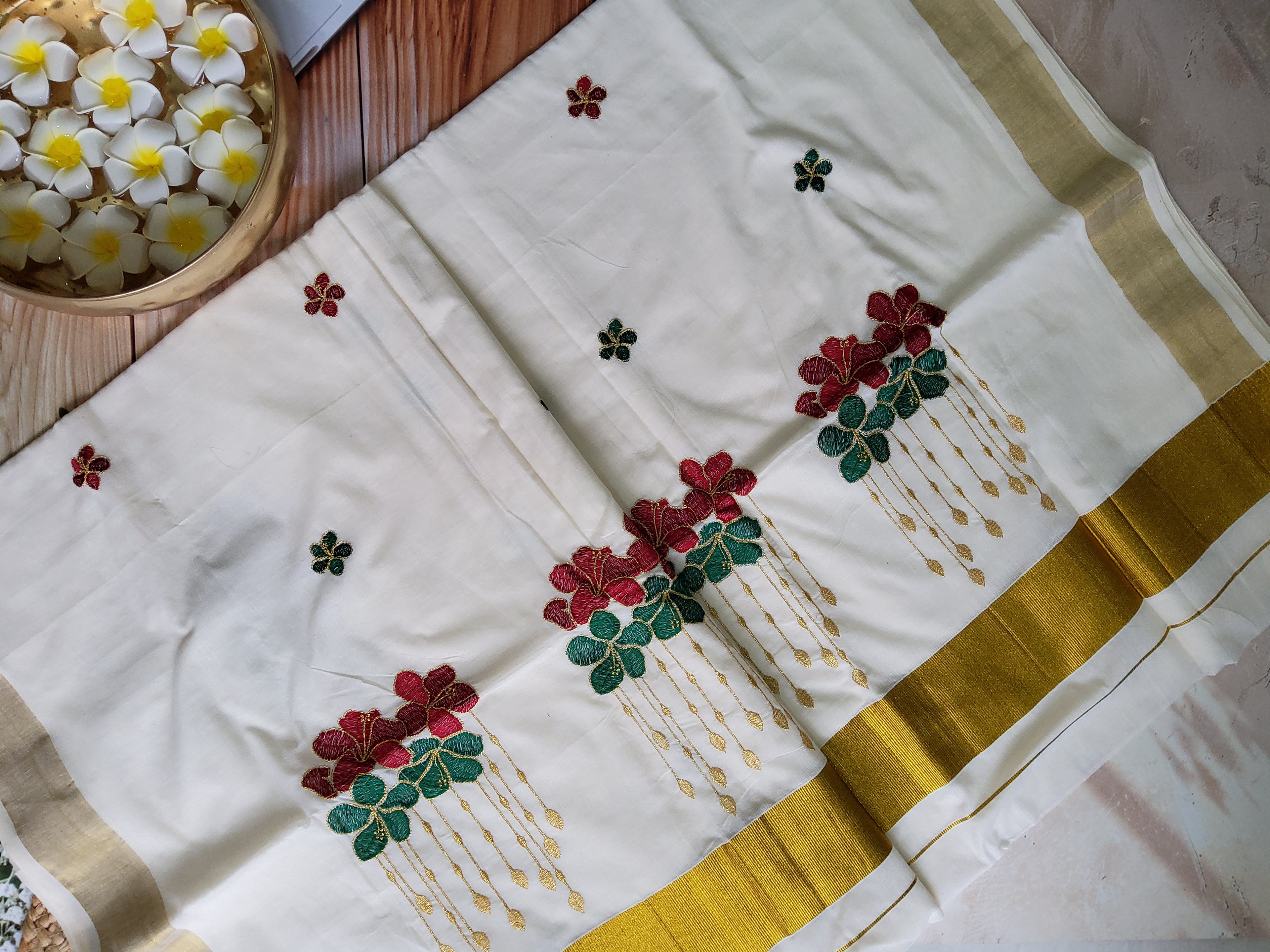 Kerala kasavu saree with floral embroidery